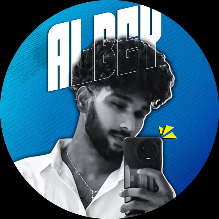 A circular framed portrait of a young South Asian man with a beard and curly hair, taking a selfie with a dark smartphone. Large white stylized typography 'ALDEV' is in the background against a blue dotted pattern. Urban street style, sharp focus, studio lighting.